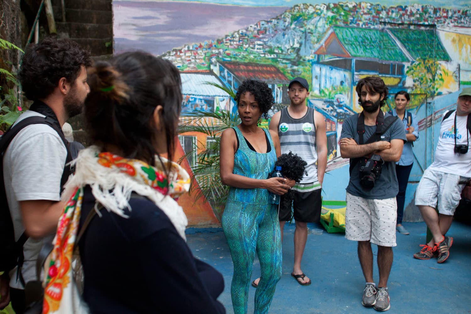 Tourists on safe guided walk through Vidigal favela with local guide